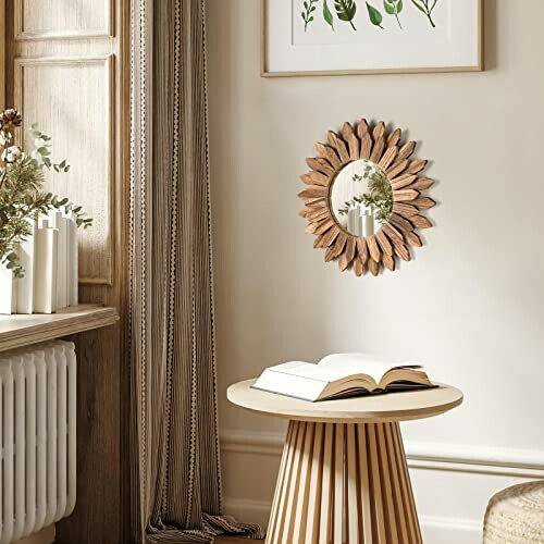 Boho-style room with a round wooden mirror, small table, and open book.