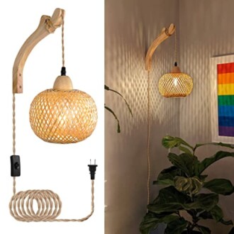 Rattan wall lamp with wooden arm and colorful flag on wall.