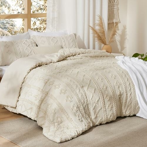 Beige bedding set in a cozy bedroom with pillows and blanket.